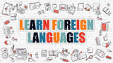 Learn Foreign Languages on White Brick Wall.