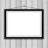 Picture frame on wood background 