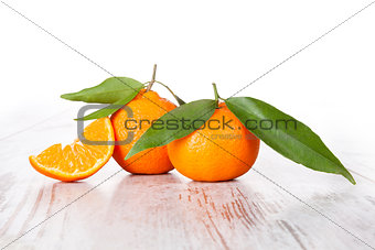 Tangerine on white wooden table. Provence style.