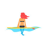 Girl Sitting On Surfboard in Water