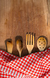 Kitchen Utensils on Wooden Table with Tablecloth
