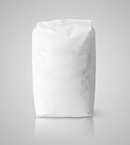 White blank paper bag package of flour on gray