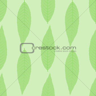 Symmetrical seamless background of green leaves