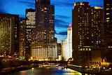 Wrigley Building surrounded by skyscrapers