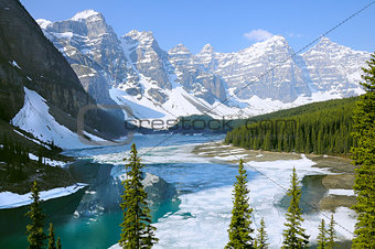 Moraine lake under the ice at spring morning.
