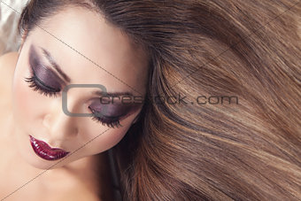 Beautiful young Thai woman with long elegant straight hair