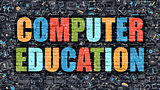 Computer Education on Dark Brick Wall.