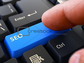 SEO Concept. Person Click Keyboard Button.