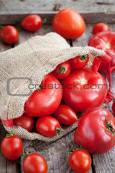 Fresh ripe tomatoes  on wooden table