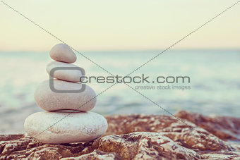 Instagram Pile of Stones on Tranquil Beach at Sunset