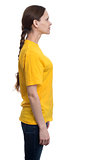 Side view of young pretty woman in yellow t-shirt