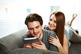 Young couple browsing the Internet on a tablet