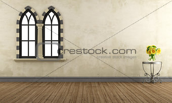 Empty retro room with gothic windows