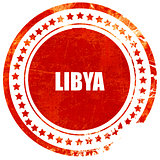 Greetings from libya, grunge red rubber stamp on a solid white b