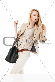 Young excited woman looking at the shop window