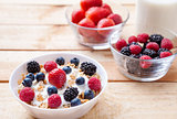 Healthy and nutritious yoghurt with cereal and fresh raw berries