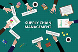 supply chain management team work together on top of table