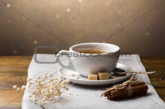 Set of tea cups with saucer and cinnamon sticks