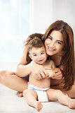 Cheerful mother with little son