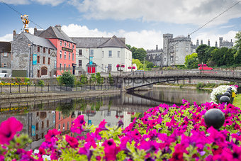 flower lined riverside view of kilkenny