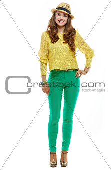 Full length portraits of happy woman in hat and bright clothes