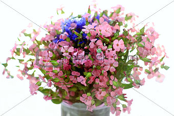bouquet of wild flowers pink and blue on a white background