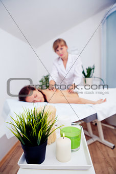 Elegant hands make a relaxing massage in spa salon young girl