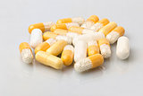 Various medical dosage capsule white and yellow