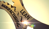 Lean Manufacturing on Golden Metallic Cogwheels.