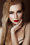 Beautiful sexy blonde girl with sensual lips, fashion hair, black art nails. Beauty face.