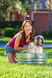 Beautiful Woman Washing Her Pet Dog In A Tub