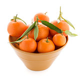 Tangerines on ceramic yellow bowl 