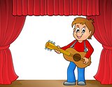 Boy guitar player on stage theme 1