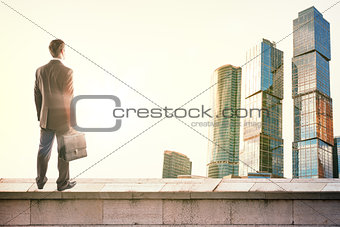 Businessman standing on roof
