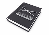 Hairdresser tool on a book