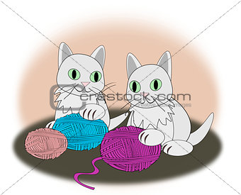 Kittens with balls of yarn