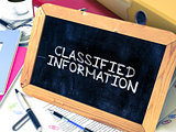 Classified Information - Chalkboard with Hand Drawn Text.