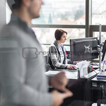 Personal assistant working in corporate office.