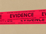 Evidence tape on cardboard