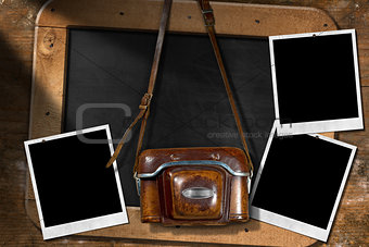 Old Camera with Empty Photos and Blackboard