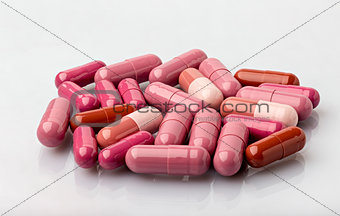 Various medical dosage capsule brown and red