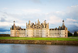 facade of Chambord chateau at sunset, France