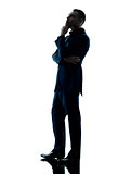 business man standing thinking isolated