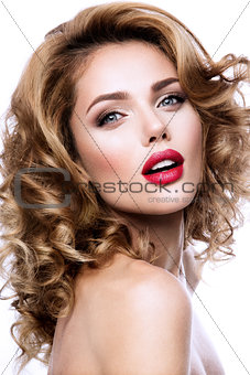 Make up. Glamour portrait of beautiful woman model with fresh makeup and romantic wavy hairstyle.