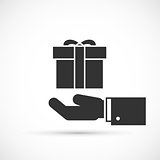 Gift box in hand icon