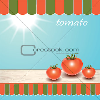 Red fresh tomatoes on the table by the window.