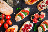 Bruschettas with tomatoes, herbs and olives