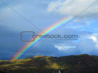 Rainbow over valley