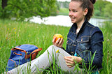Girl with apple on a picnic