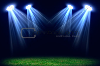 Grass field lit with bright spotlights